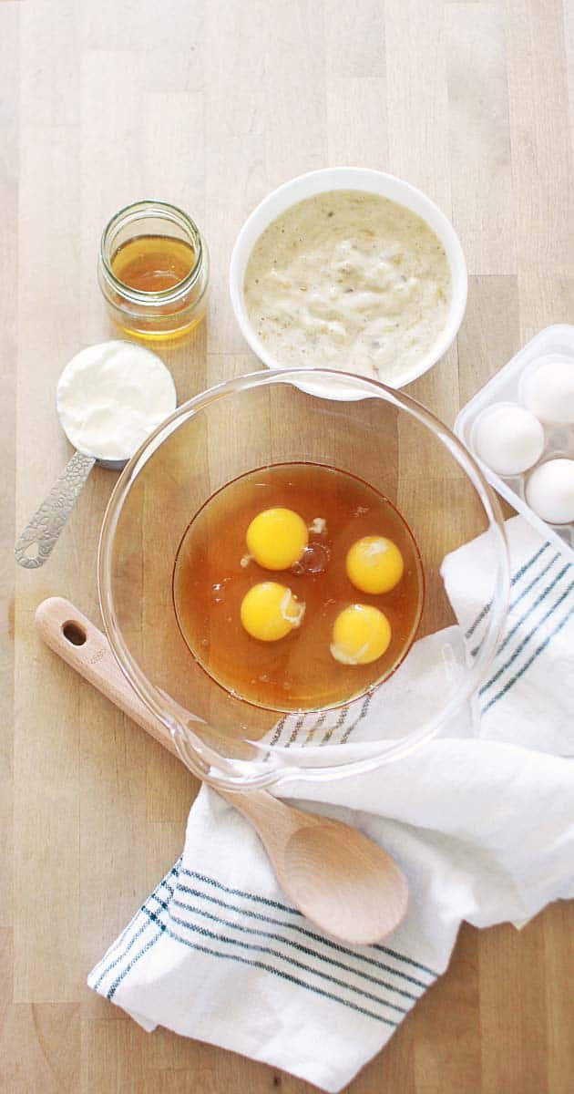 healthy wet ingredients for breakfast in a bowl with a wooden spoon