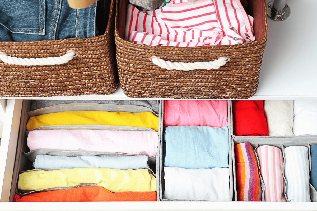 An organized kids closet with clothes stored neatly