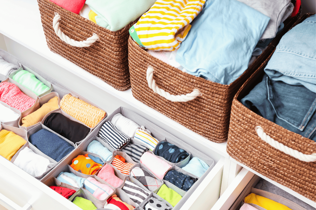An organized kids closet with clothes stored neatly