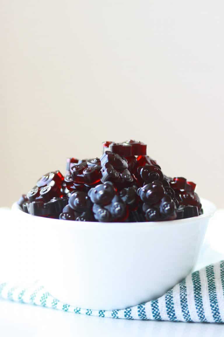 a bowl of dark red gummies