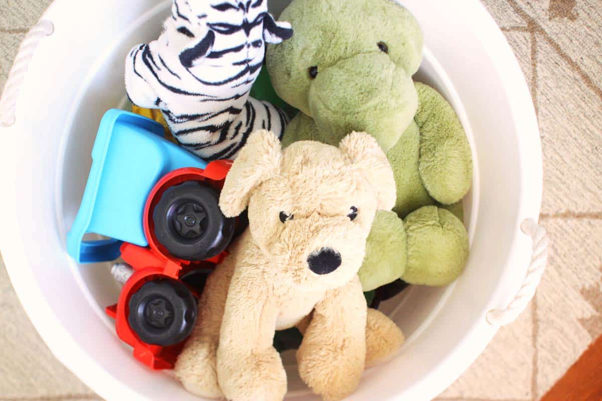 a large white bucket full of stuffed animals