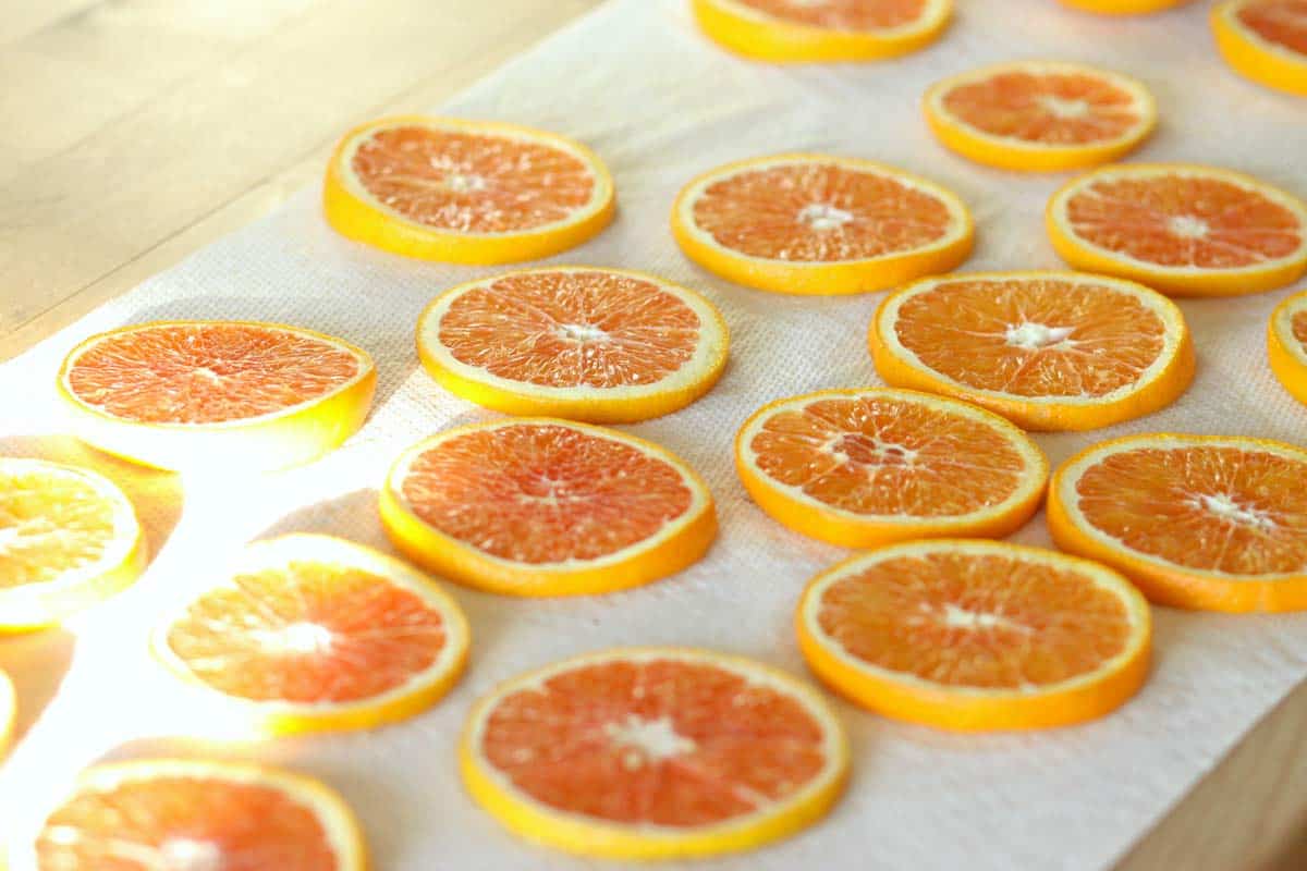 blood orange slices laid out on paper towels